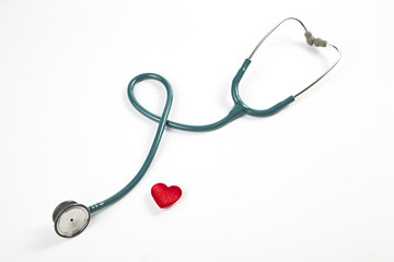 Red heart and stethoscope isolated on white background