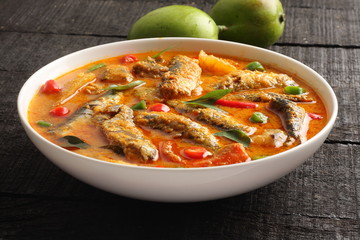 Delicious coconut milk fish curry,with mango cuts
