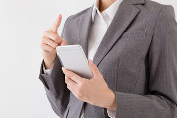 携帯電話を操作する女性、インターネット、メール