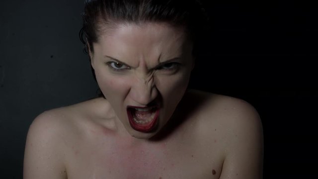 4k shoot of a horror Halloween model - Evil girl screaming at camera