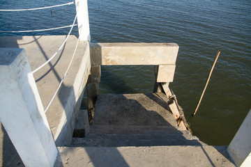 Stairs for Up and down for the fishermen at white cement bridge © bubbers