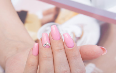 Perfect manicure and natural nails. Attractive modern nail art design. Gel polish applied.