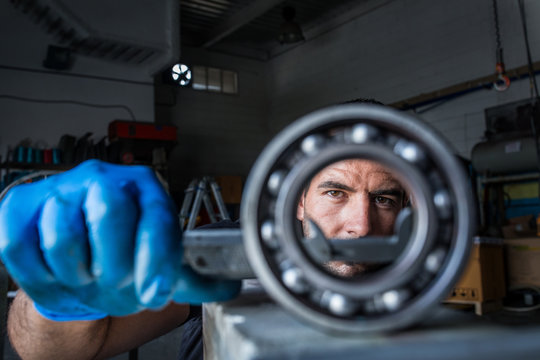 Mechanic fixing a compressor engine