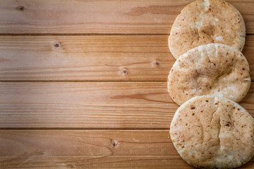 Pita, Arabic bread, wooden background, free text space