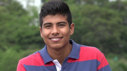 Handsome Teen Boy Smiling In Park