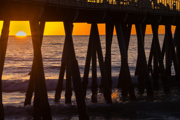 Surfers under the Hermosa Beach Pier