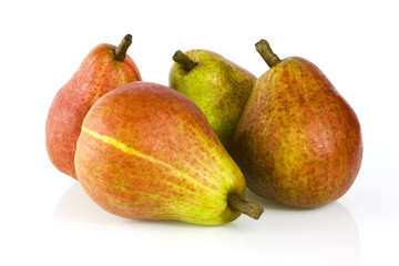 Four ripe pears isolated on white background. Still-life picture taken in studio with soft-box.