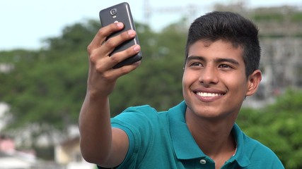 Good Looking Teen Boy Taking Selfy And Smiling