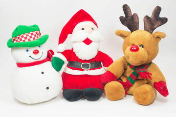 Reindeer doll and Santa doll with snowman doll on white backgrou
