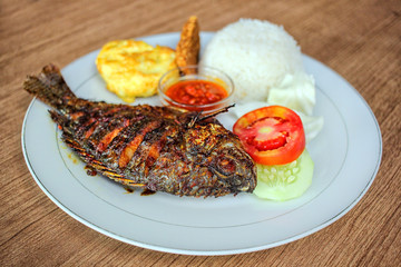 Grilled Fish Dish with Rice and Vegetables