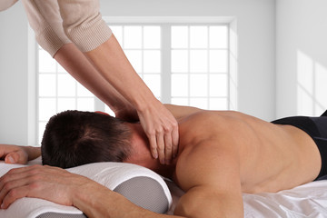 Man having sport massage. Acupressure, Chiropractic, osteopathy,