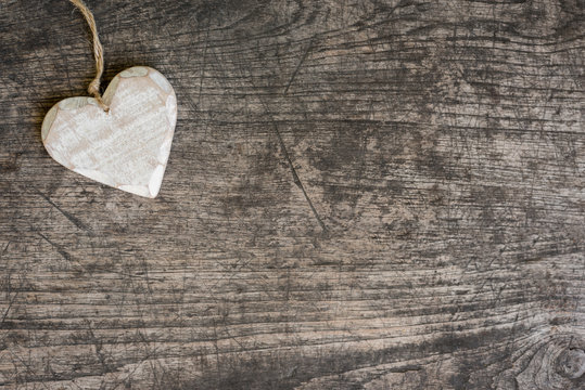 white wooden heart on rustic table