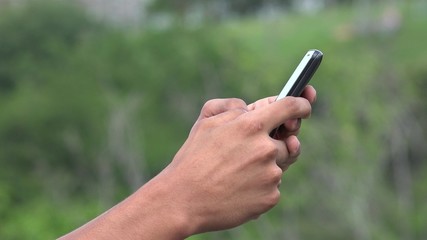 People Using A Smart Phone For Texting And Browsing Internet