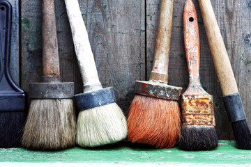 painted old board and brush lying on them