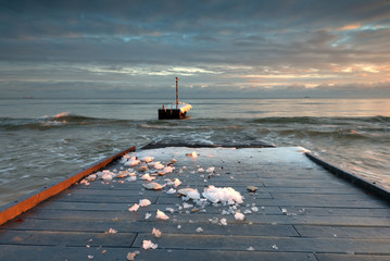 Winter landscape. Frozen jetty with view of Bay of Gdansk. Poland, Europe.