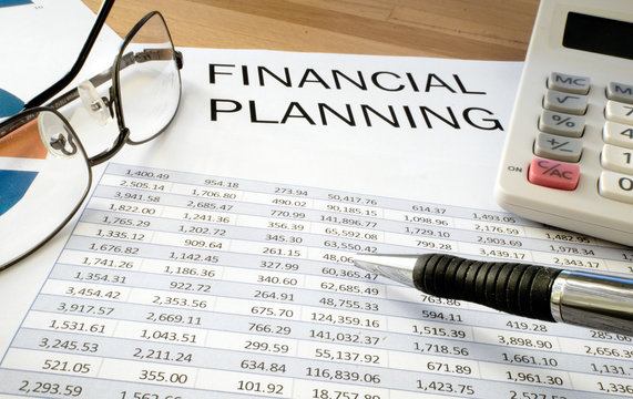 Financial planning with pen and glasses