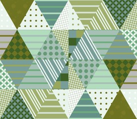 Ethnic patchwork pattern in green tones. Seamless background. Vector illustration of quilting. © Happy Dragon