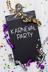 carnival confetti on wood background