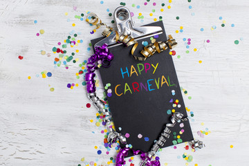 carnival confetti on wood background