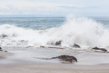 Waves crashing to rocks montezuma beach