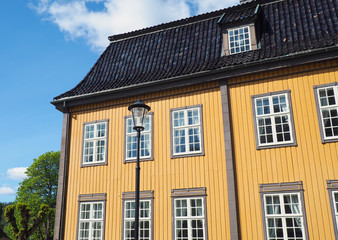 Fototapeta na wymiar Yellow painted wooden house in Norway