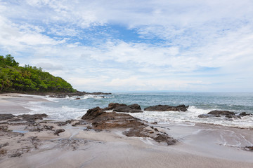 Waves crashing to rocks montezuma beach