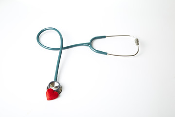 Red heart and stethoscope isolated on white background