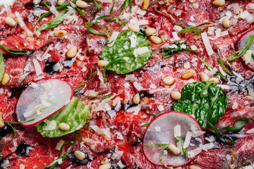 dish with carpaccio of beef