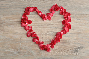 Valentine's Day. A heart made out of red rose petals