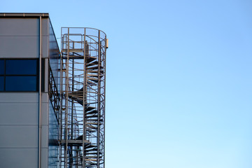 Spiral staircase against clear blue sky