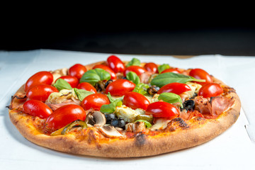 tasty capricciosa pizza on a the table