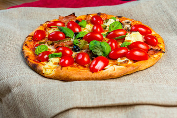 tasty capricciosa pizza on a the table