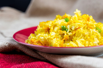 Homemade Chinese fried rice with vegetables and fried eggs