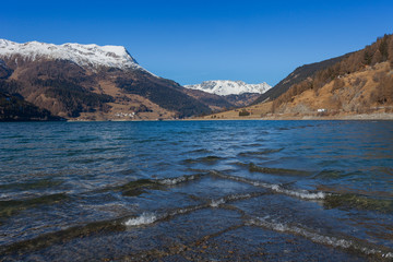 Fototapeta premium Waves intersection at the Resia lake; Resia/Reschen, Italy