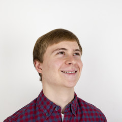 Portrait of happy handsome young man on white background