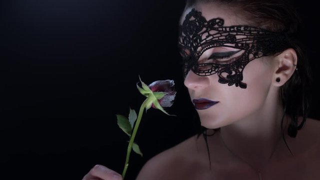 4k shoot of a horror Halloween model - Vampire with mask looking evil at camera