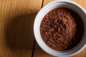 Obraz na płótnie Canvas Cocoa powder in a bowl