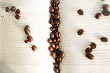 Coffee beans on the background of the book