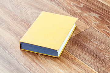 The book yellow colour in a firm cover.