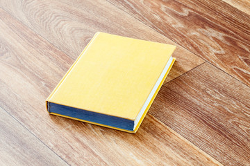 The book yellow colour in a firm cover.
