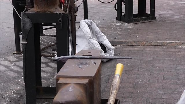 Modern blacksmith in capital demonstrates their ability to manufacture fasteners at Christmas fair
