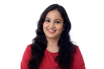 Portrait of cheerful woman against white background