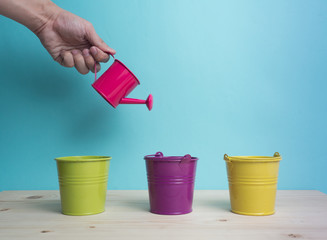 Watering can color and color background for copy space create idea for business ,something.