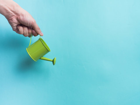 Watering can color and color background for copy space create idea for business ,something.