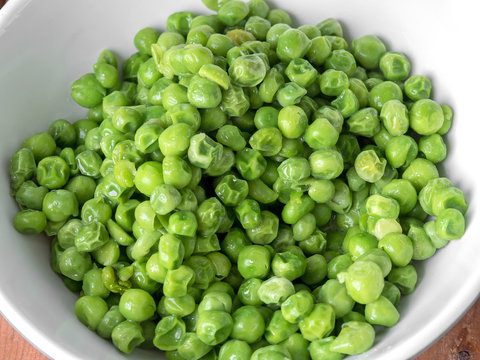 green peas in a white bowl