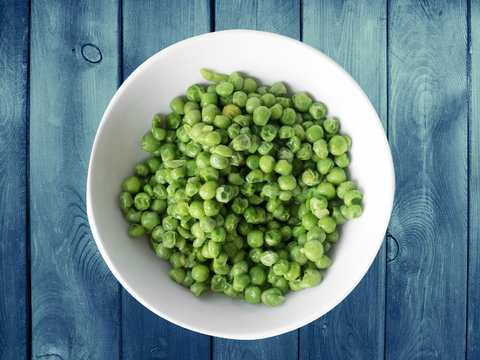 green peas in a white bowl