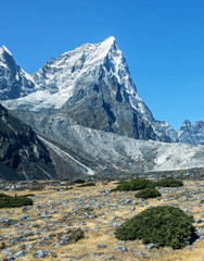 Fototapeta na wymiar The Tabuche (6367 m) peak on background blue sky, view from Periche village - Everest region, Nepal, Himalayas