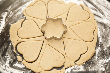 Cut the shape out of the dough for ginger cookies