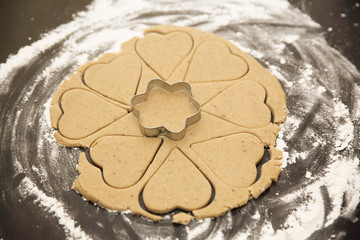 Cut the shape out of the dough for ginger cookies