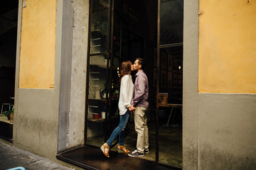 Obraz na płótnie Canvas Couple on a date. Kissing couple in love come in cafe. Couple in love.